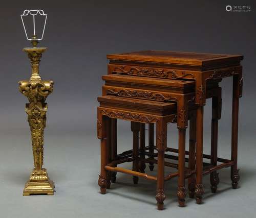 A nest of three Chinese hardwood and brass inlaid tables, 20th Century, each with carved dragon