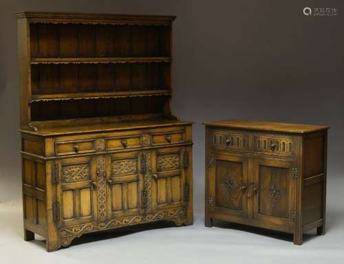 A 17th Century style carved oak dresser, early 20th Century, surmount with plate rack having two