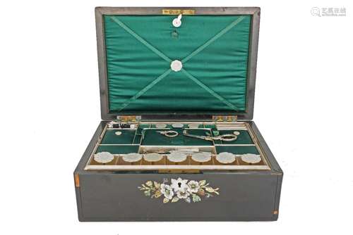 A Victorian ebonised wood and mother of pearl inlaid sewing box, the interior with a pull out try,