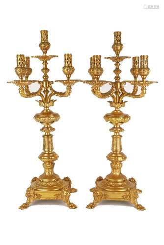 A pair of Victorian gilt metal five light candelabra, in the Baroque taste, late 19th century, , the