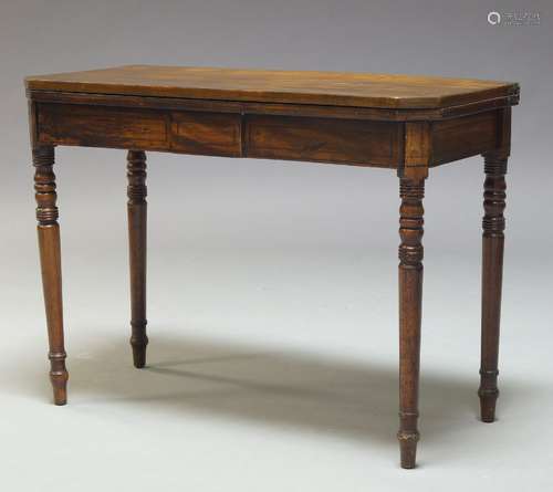 A George III mahogany and line inlaid card table, the fold over top enclosing green baize lined