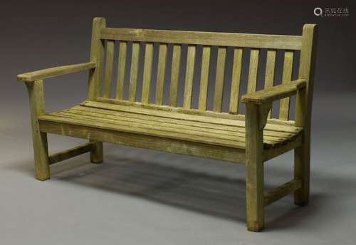 A teak garden bench, late 20th Century, with slatted back and seat on square supports, 91cm high,