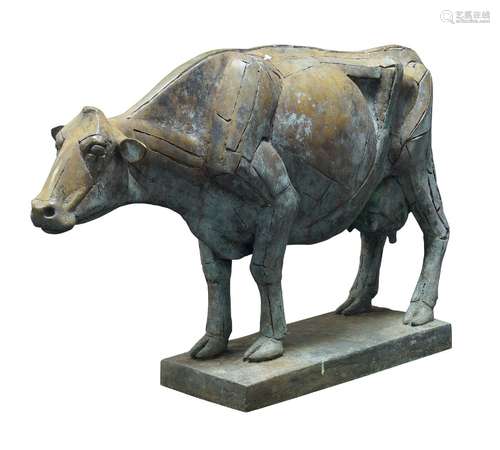 A large metal model of a Friesian cow, standing on a plinth, 49cm high150