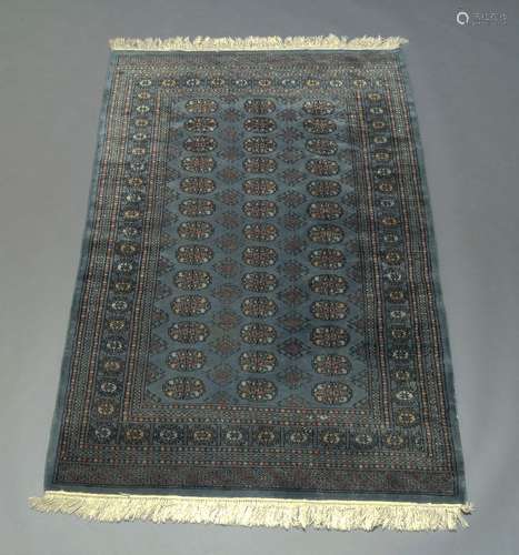 A Pakistan rug of Tekke design, with three rows of guls in a light blue field, 183cm x 123cm80