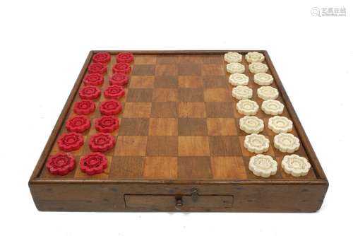 A Victorian satinwood and rosewood games table, of square shape with a drawer to the frieze, 39cm