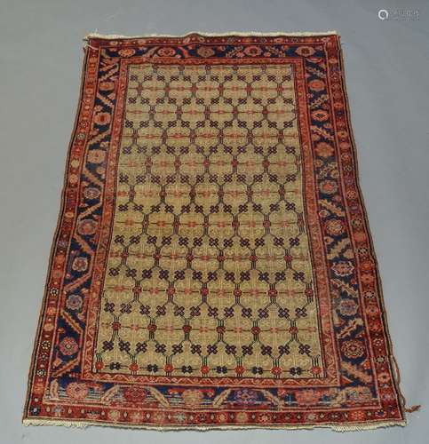 A Northwest Persian rug with oatmeal coloured field and indigo main border, 186cm x 127cm200