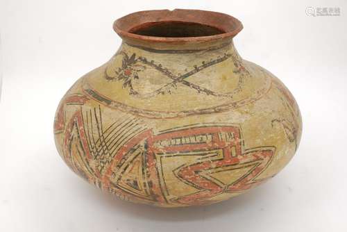 A large Pre-Columbian earthenware vase of bulbous form with flared lip, decorated with geometric