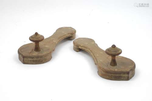 A pair of Islamic Indian hardwood clogs with turned finials to the top, 25cm long (2).60