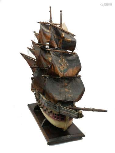 A polychromed wooden model of a four mast galleon, 20th century, on a wooden stand, 70cm high100