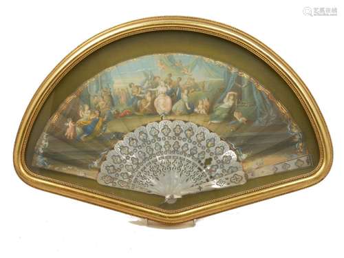 A French paper and mother of pearl fan, early/mid 19th century, the leaf decorated with a print of