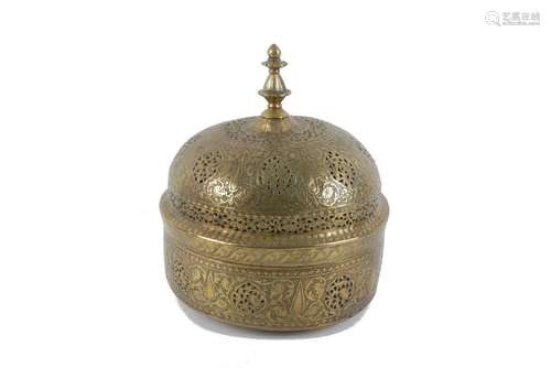 A brass openwork lidded pandan box, India, late 18th century, the domed lid with a facetted