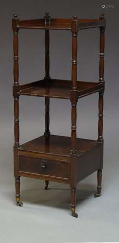 A mahogany three-tier square whatnot, mid-19th Century, with ring turned supports and single base