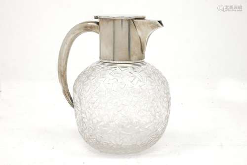 A German silver mounted cut glass dimpled wine jug, J.Netter & Cie., the globular, dimpled glass