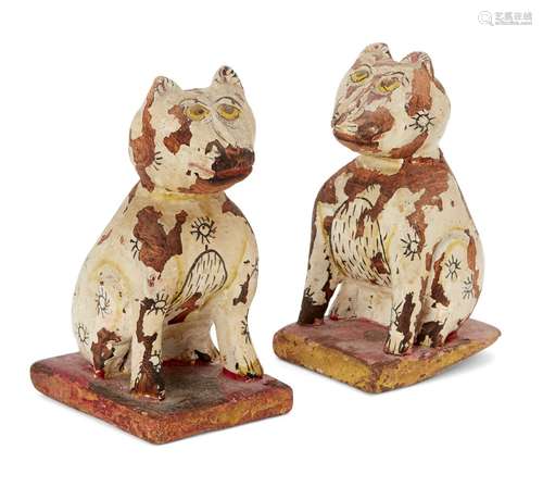 Pair of painted carved wood cats, Rajasthan, India, 19th century, on square bases, 12cm. high (2)50