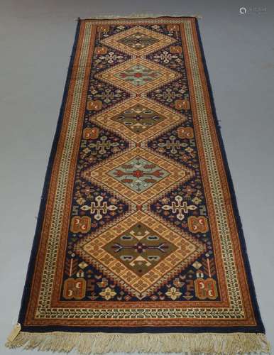 A runner with five medallions, 325cm x 101cm, along with two modern rugs and a patchwork quilt (4)