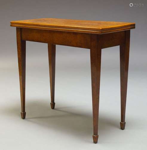 A George III burr walnut and line strung card table, the rectangular quarter veneered top, enclosing