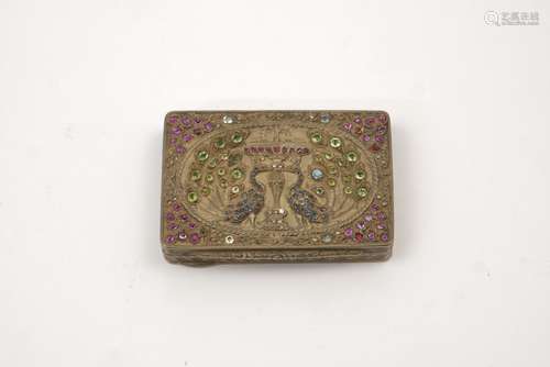 A white metal gilded gemstone set rectangular snuff box, the top decorated with peacocks flanking