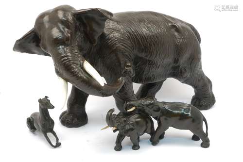 A patinated spelter model of an elephant, late 19th/early 20th century, 32cm high, together with a