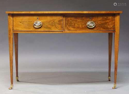 An Edwardian mahogany bowfront side table, with two cockbeaded drawers, raised on square tapering