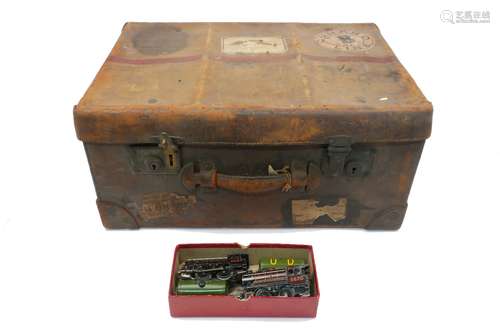 A vintage leather suitcase with Cunard Line Class B 