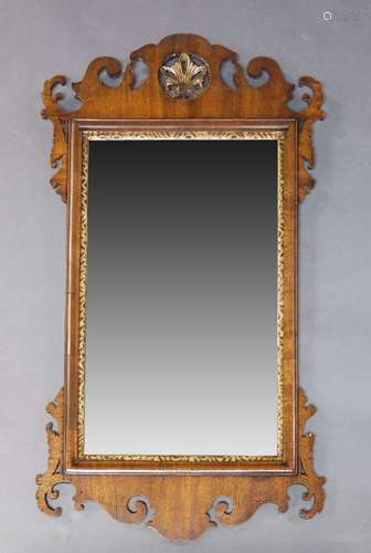 A George II style mahogany and parcel gilt fretwork wall mirror, early 20th Century, the crest