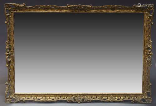 A carved gilt wood mirror, in the Louis VI taste, second half 20th Century, of rectangular form with