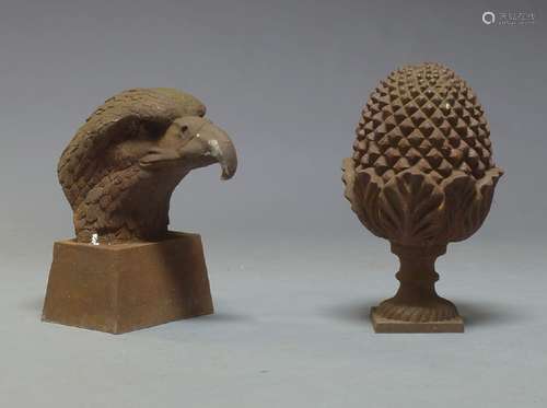 A cast iron eagle head, 20th century, raised on tapered plinth base, 48cm high, together with a cast