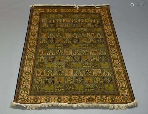 A Qum silk rug, late 20th Century, of garden design, the finely woven panel field enclosed by