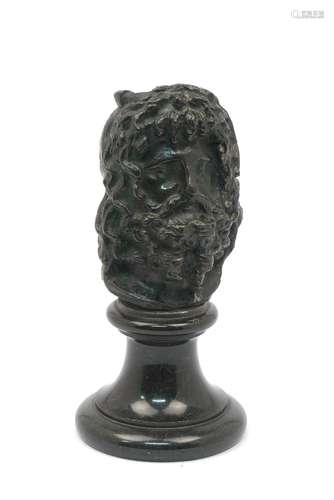 A 19th century bronze head mounted on a green marble plinth, 20.5cm high200