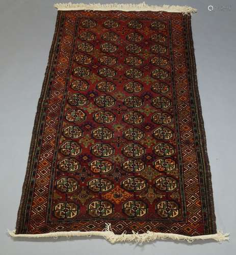 A Turkmen rug, with four rows of Guls, 194cm x 99cm, a Turkish rug, a Turkish runner, a West Persian