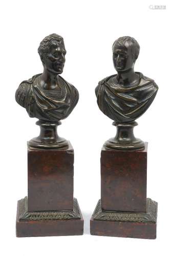 A pair of Grand Tour bronze busts of Roman Emperors, 19th century, mounted on rouge marble and stone