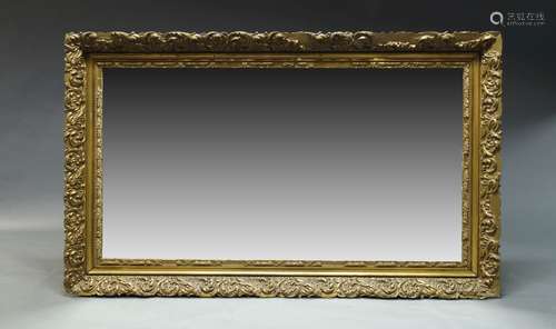 A large gilt overmantle mirror, second half 20th Century, of rectangular form, with scrolling