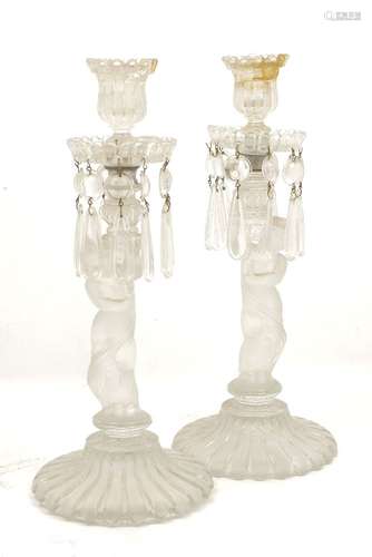 A pair of early 20th century caryatid glass candlesticks with glass droppers, together with a