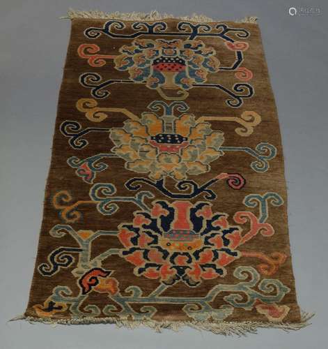 Two Chinese rugs, with brown fields, together with a pictorial panel (3)150