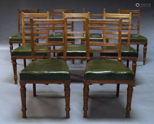 A set of nine late Victorian mahogany dining chairs, with slatted backs above green leather