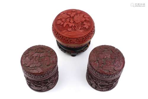 A pair of Chinese cinnabar lacquered cylindrical boxes, late 19th/early 20th century, with lids,