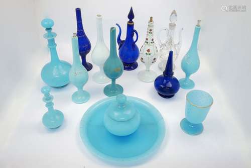 A group of blue and white glass Turkish sprinklers, together with a blue glass plate, jar with