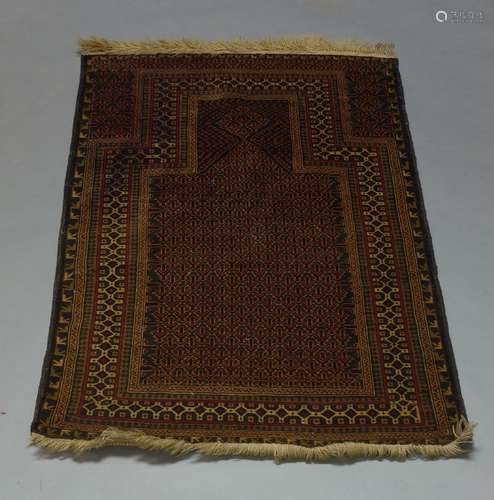 A Belouch prayer rug, 134cm x 88cm, together with a Kazak rug, an Indian Dhurry and a Turkmen rug (