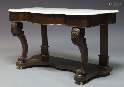 An early Victorian mahogany washstand, the white serpentine marble top, above single frieze