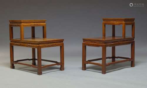 A pair of Chinese hardwood stands, late 20th Century, of rectangular form, each with raised shelf