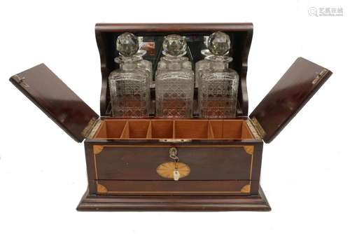 An Edwardian mahogany inlaid tantalus, c.1910, decorated with shell motifs, opening to reveal