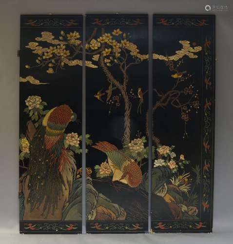 A Chinese three fold lacquer screen, late 20th Century, decorated with peacock and foliage, 214cm