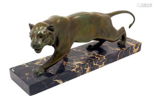 An Art Deco bronze tiger on marble base, c.1930's, crouching full length, 51cm wide.150