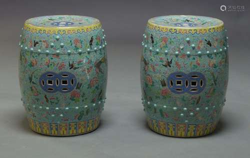 A pair of Chinese green ground porcelain garden seats, each of barrel shape, the sides and top