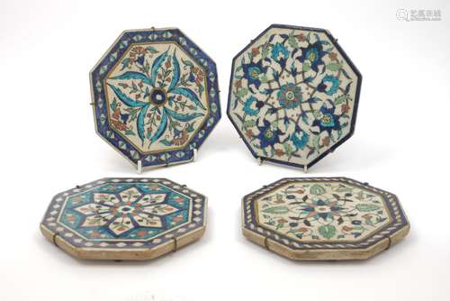 Four Persian Iznic style octagonal tiles, 19th century, each decorated with geometric flowers, 15.