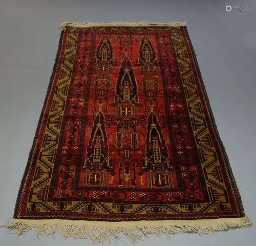 A Shiraz rug, with two step edge indigo medallions 203cm x 122cm and a Turkmen rug, with stylised