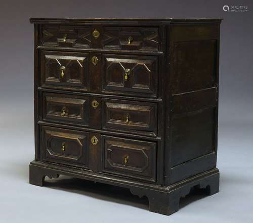 A Charles II oak chest of drawers, the rectangular top above four long drawers, the drawers with