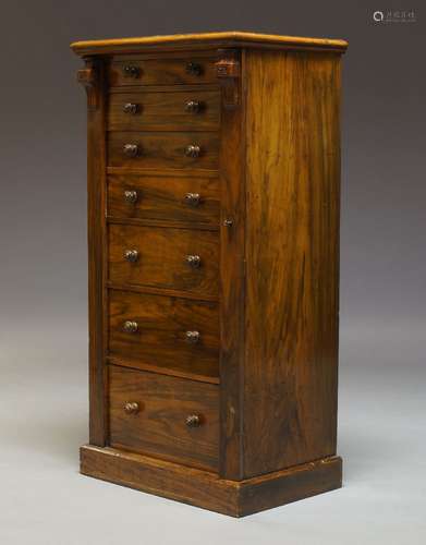 A Victorian figured walnut Wellington chest, with seven graduated drawers, raised on plinth base,