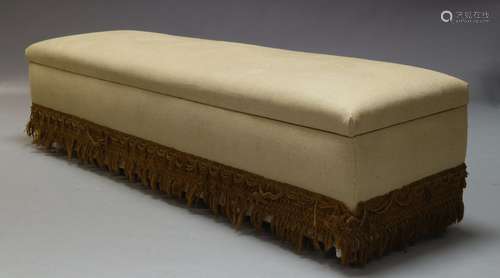 A large cream upholstered banquette, 20th Century, the hinged lid enclosing storage space within,