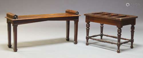 A Victorian mahogany hall bench, the rectangular seat with shaped bolster handles, raised on